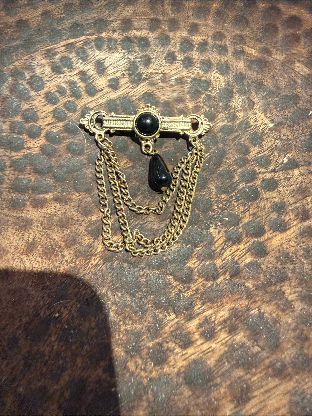 Gold-Tone Brooch with Black Stone and Draped Chains